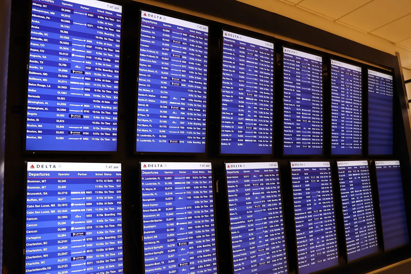 Banks of departure screens in a concourse at Hartsfield-Jackson Atlanta International Airport