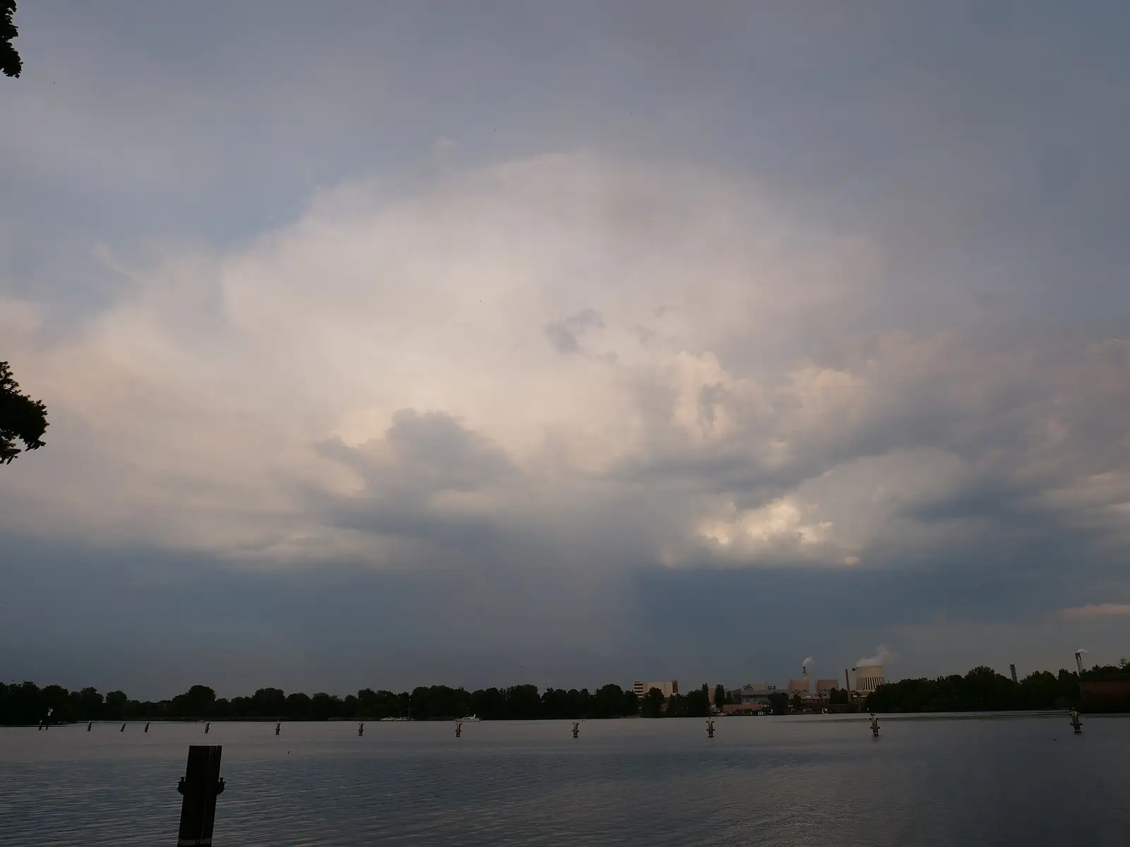 A thunderstorm cloud building over the horizon on a summer evening