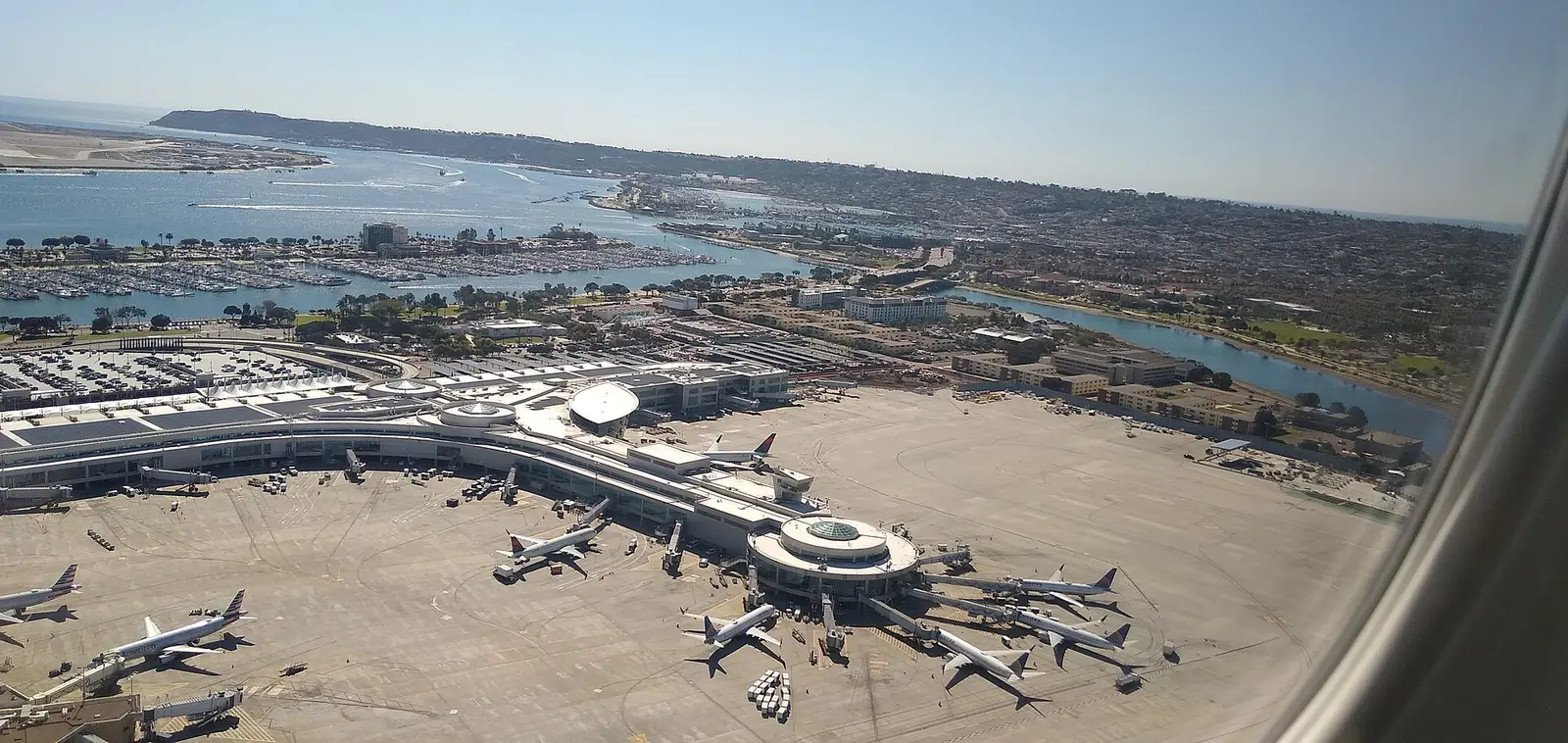 Aerial view of San Diego International Airport beside the bay