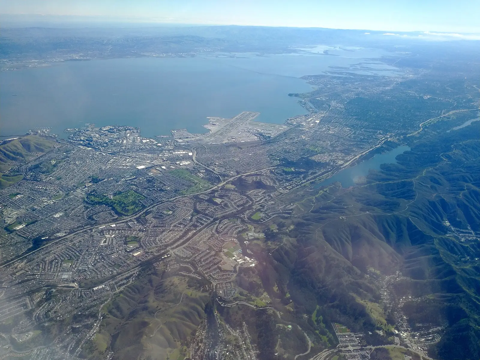 Aerial view over San Francisco International Airport and the bay shoreline