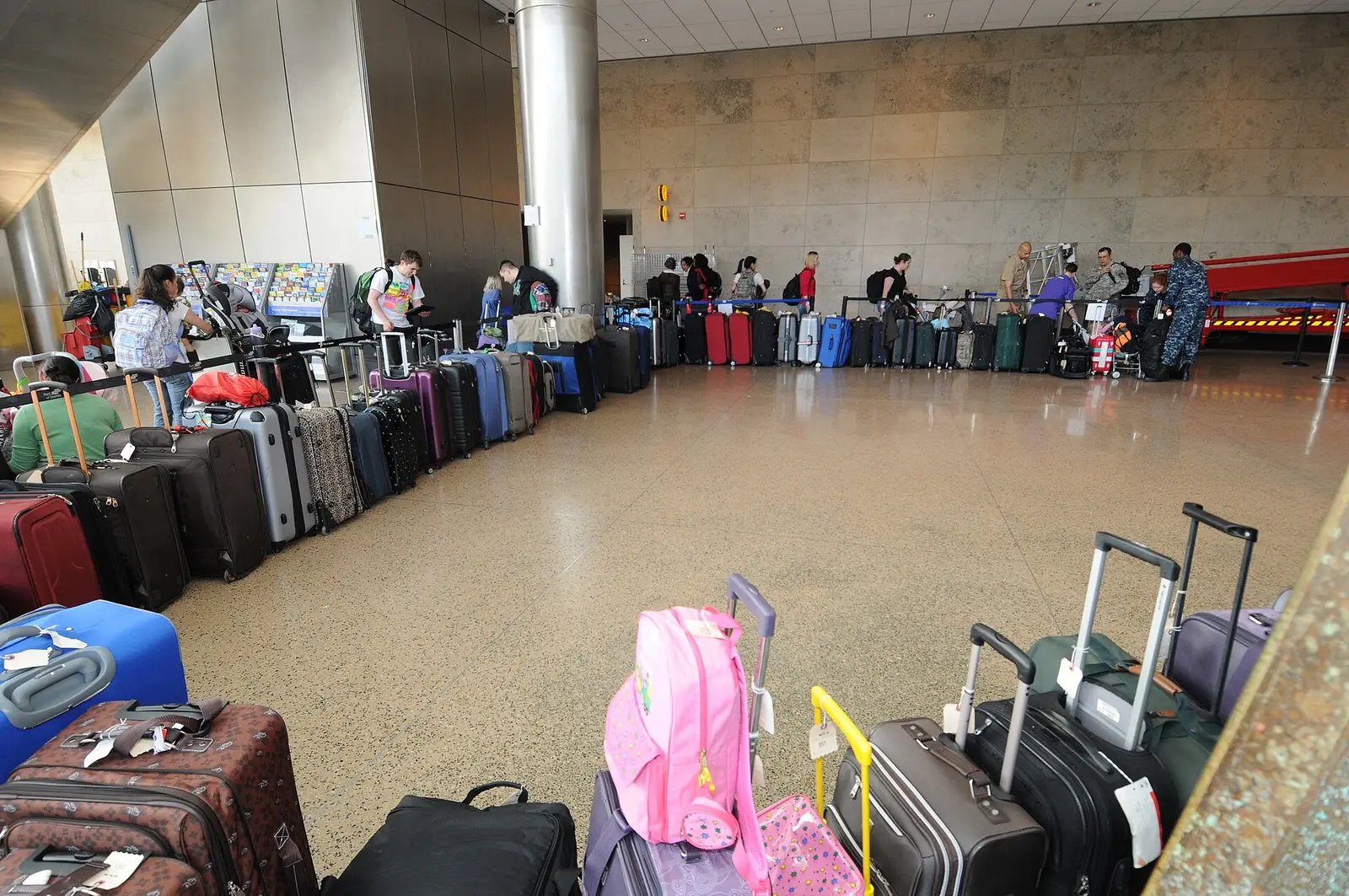 Rows of suitcases waiting in a terminal hall at Seattle-Tacoma International Airport